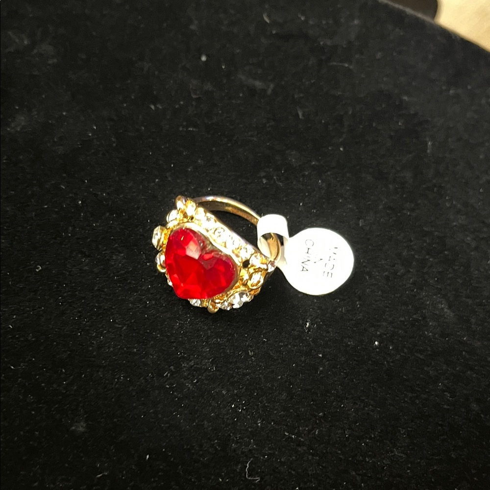 Radiant Gold Ring with Red Heart Gem